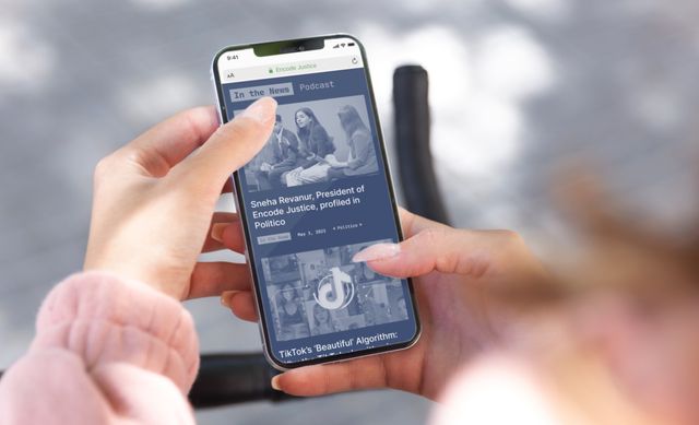 woman-holding-phone-browsing-encode-justice-site