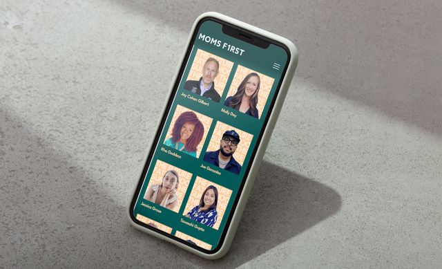 woman-holding-phone-browsing-moms-first-site