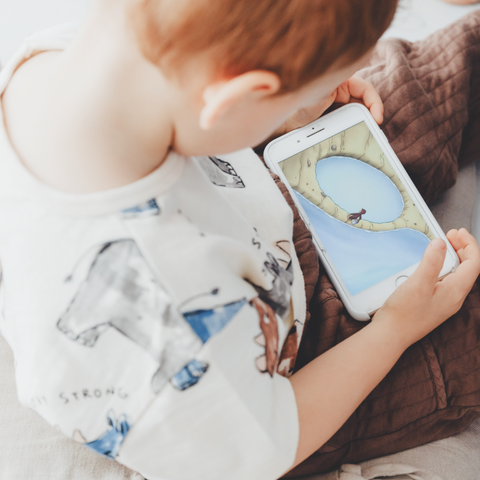 child-holding-iphone-looking-at-image